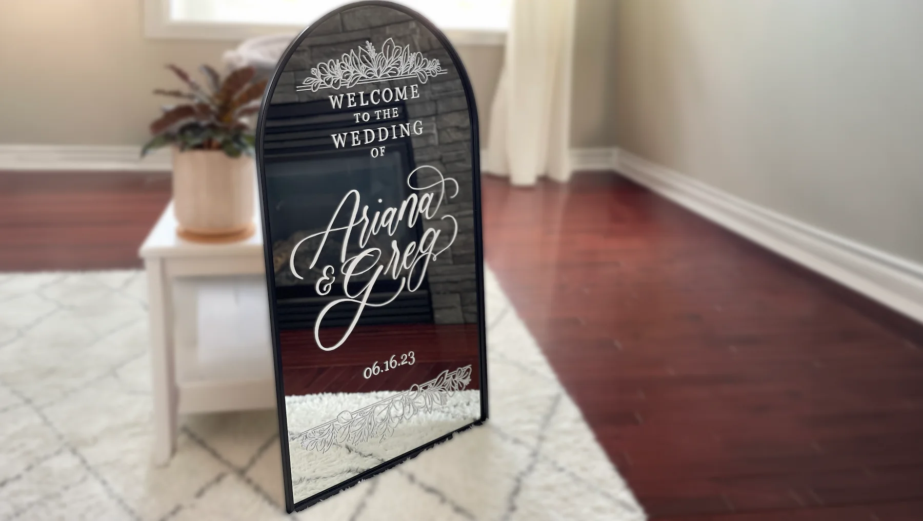 Wedding welcome sign with white calligraphy on a mirror